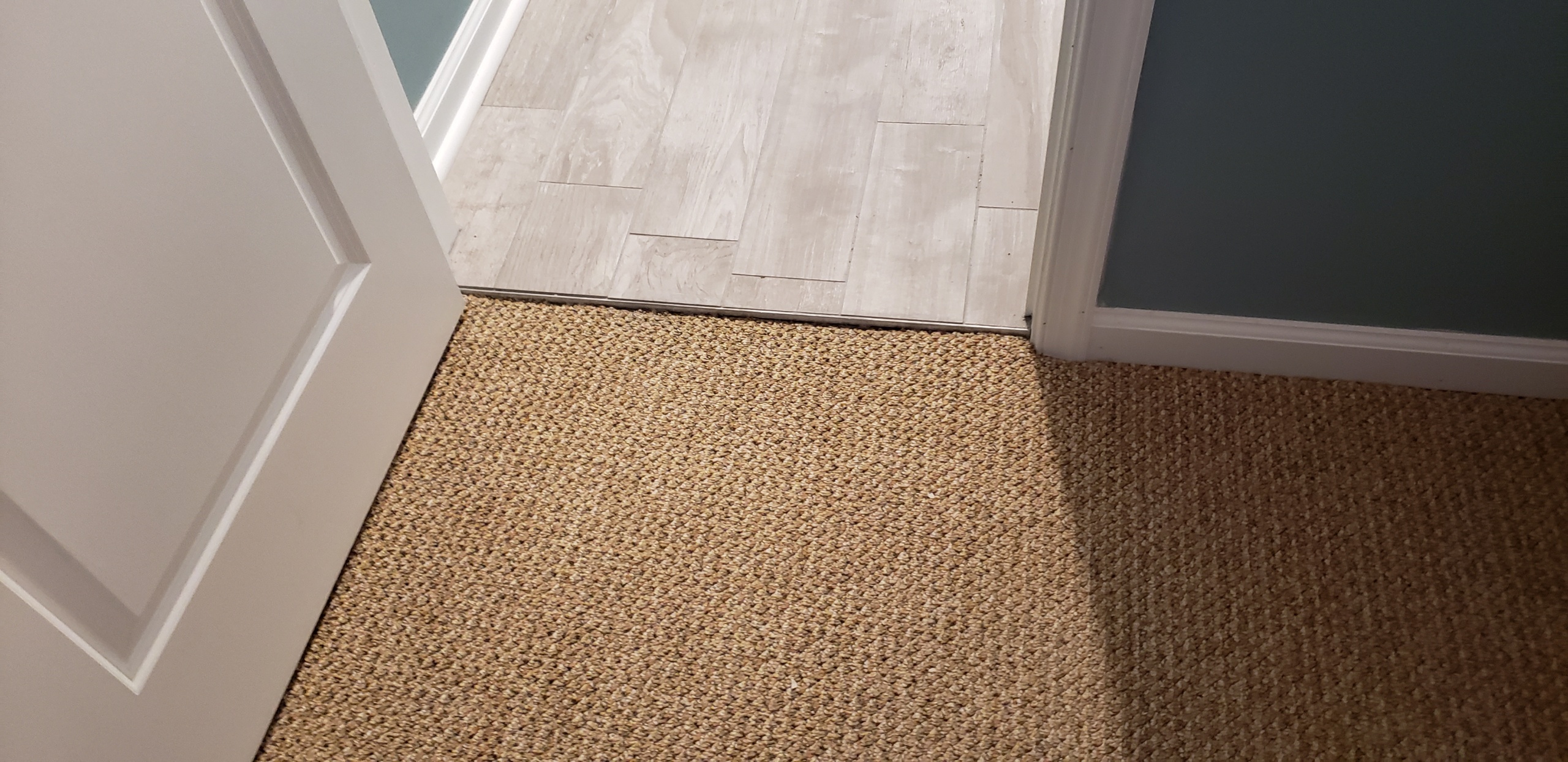 Restretched Berber Carpeting to meet the New Tile floor in Sea Isle